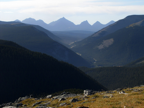 Mount Pierce, Farquhar, unnamed, Mount Holcroft, and Mount Scrimger create interesting silhouettes to the west.