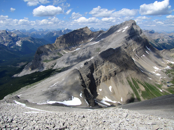 Golden Mountain and Nasswald Peak dominate the view to the northeast. The ridgeline heading towards Nasswald's summit marks the continental divide (British Columbia on the left, Alberta on the right).