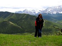 Sharon and Amy stand on Junction Hill's lower ridge with the Divide in the background.
