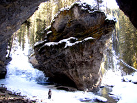 Riley gives a sense of scale to this beautiful location below the rim of Johnston Canyon.