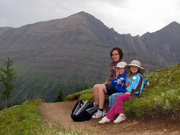 This picture looks a bit foreboding, but Sharon, Riley, and Amy all had an enjoyable and rain free trip to Ptarmigan Cirque. Highwood Ridge is the prominent mountain behind them.