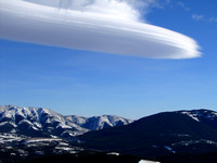 Lenticular clouds are one of the most amazing formations in the sky over the Rockies. Robertson Peak is on the right.