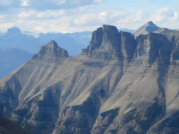 Here is a closer look at the impressive cliffs on Spreading Peak's outlier. Part of Mount Erasmus can be seen on the extreme left and Bison Peak is the highest on the right.