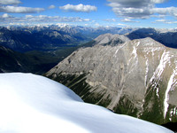 To the northeast is the Bow Valley with Cascade Mountain, Lake Minnewanka, and Mount Inglismaldie visible top center.