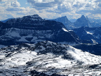 The Monarch towers over Twin Cairns with the spectacular White Tail Peaks in the distance on the right. Howser Towers and Bugaboo Spire are visible just to the right of the highest White Tail Peak.
