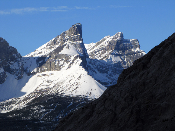 The Fortress and Gusty Peak look great from this angle. The dark cliff in the foreground is part of The Wedge.
