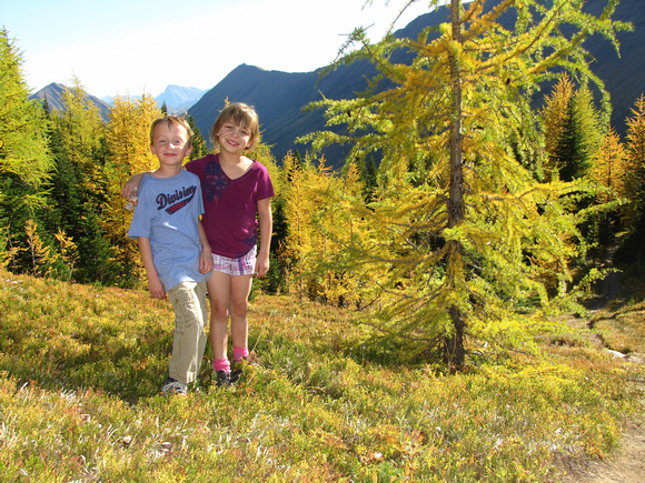 On the way down from Ptarmigan Cirque, the kids pose in front of some great Alpine Larches almost finished the transformation into their fall colors.