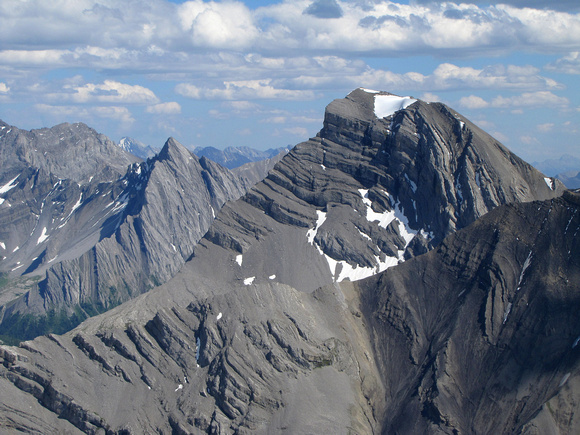The striking looking closer peak has no name, but the pointy one is Mount Allenby.