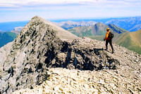 Andrew Nugara heads northeast along the ridge to the true summit.