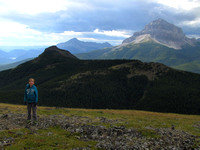 Riley poses on the south summit of McGillivray Ridge. Wedge Mountain is right behind him with Tecumseh beyond on the left and Crowsnest dominating on the right