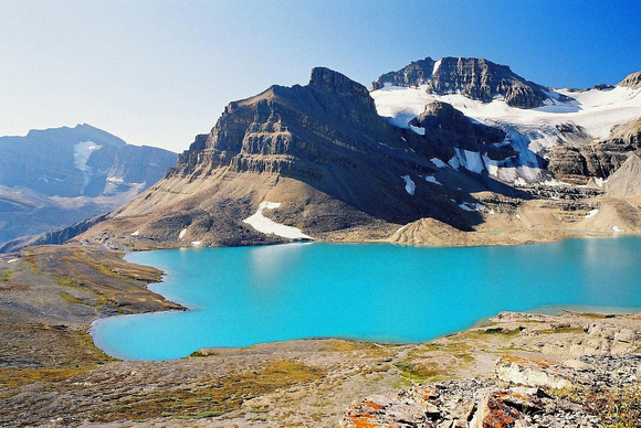 An early morning view of the "glowing" waters of Caldron Lake with  Peyto Peak in the background.